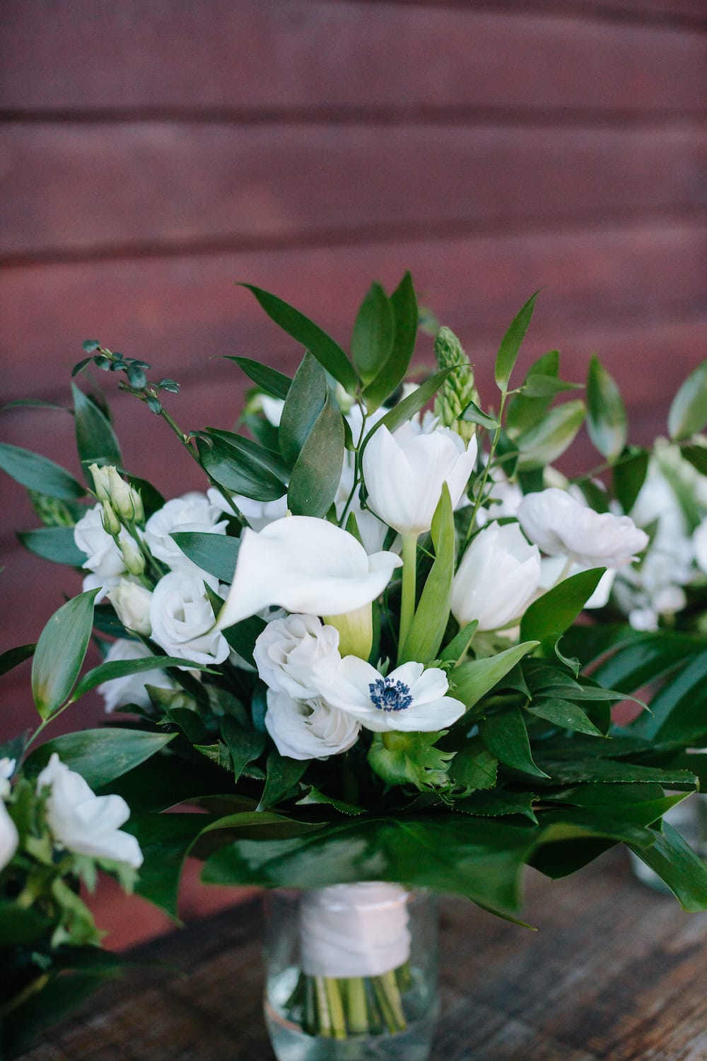 white winter bridesmaids bouquets with tulips, anemones, lisianthus and bouvardia
