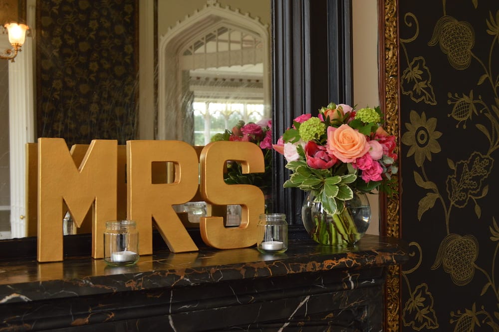 mr and mrs mantelpiece decor with flowers at nonsuch mansion