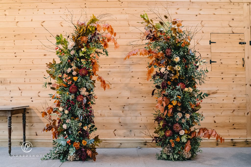autumn flower and foliage wedding archway at chafford park kent