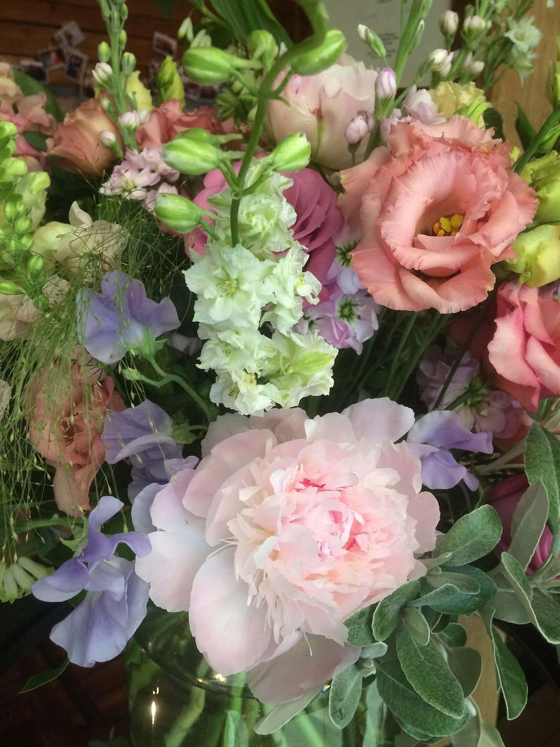 welcome vase with peonies, stocks and sweetpeas at Sussex Barn wedding