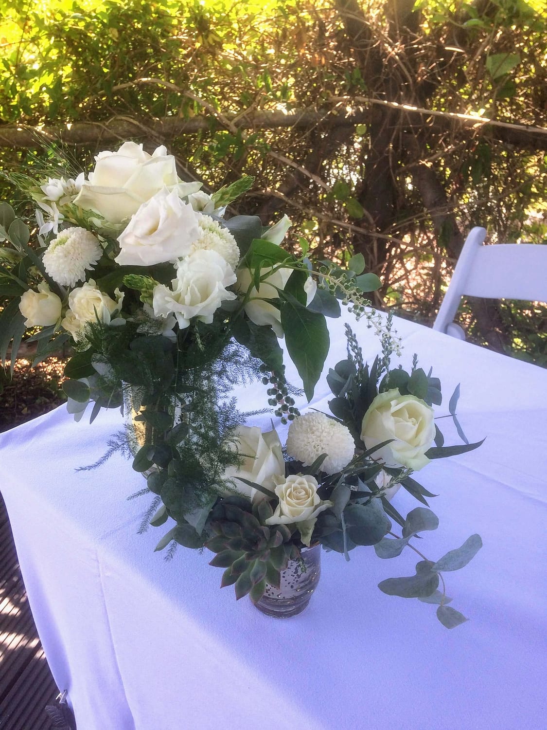 white roses an eucalyptus outdoor ceremony flowers at the house meadow