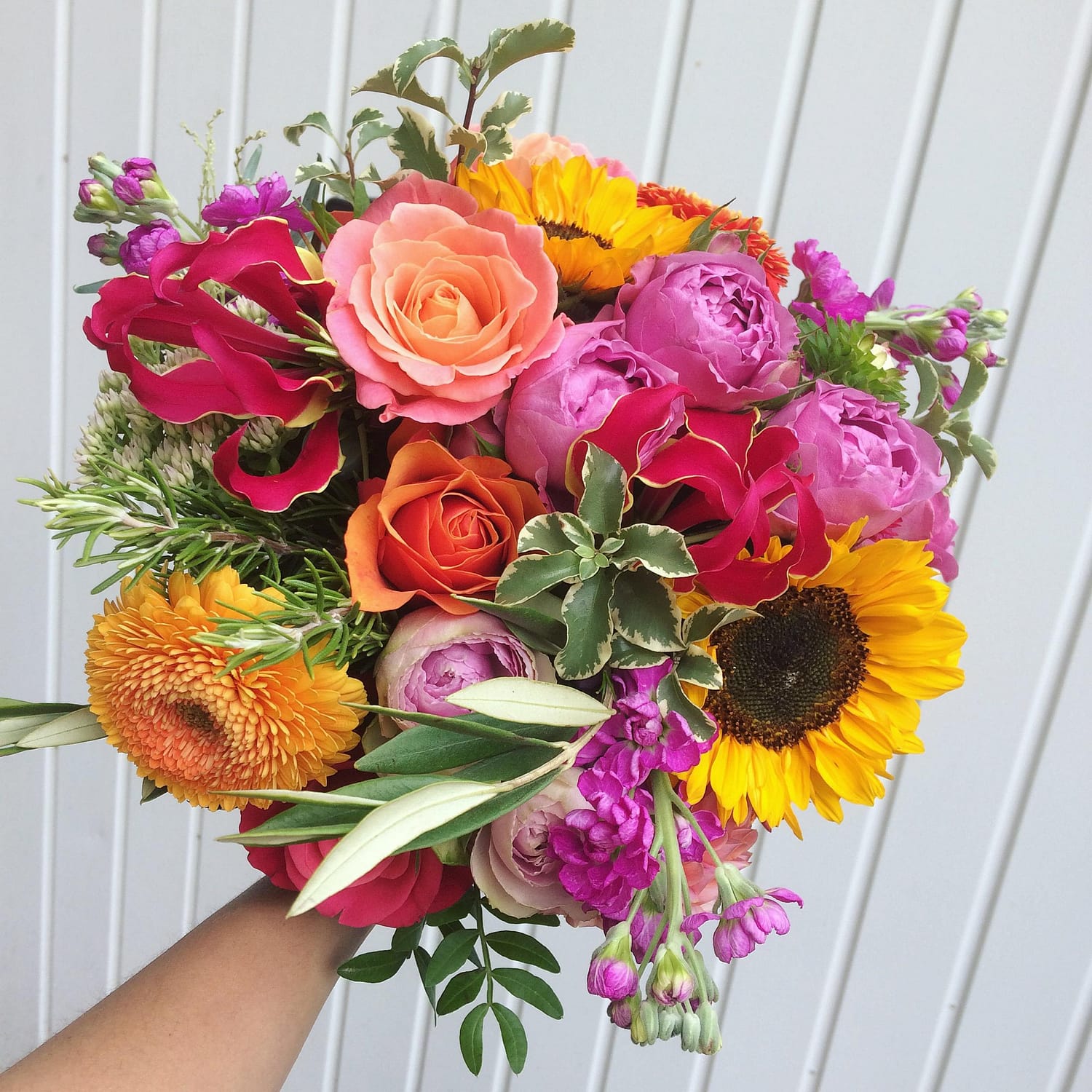 hot cerise pink and yellow bridal bouquet with sunflowers
