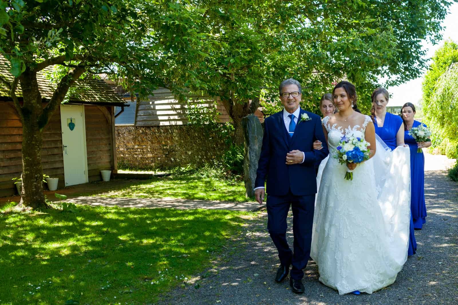 bride and her blue and white bouquet at The English Wine Centre East Sussex