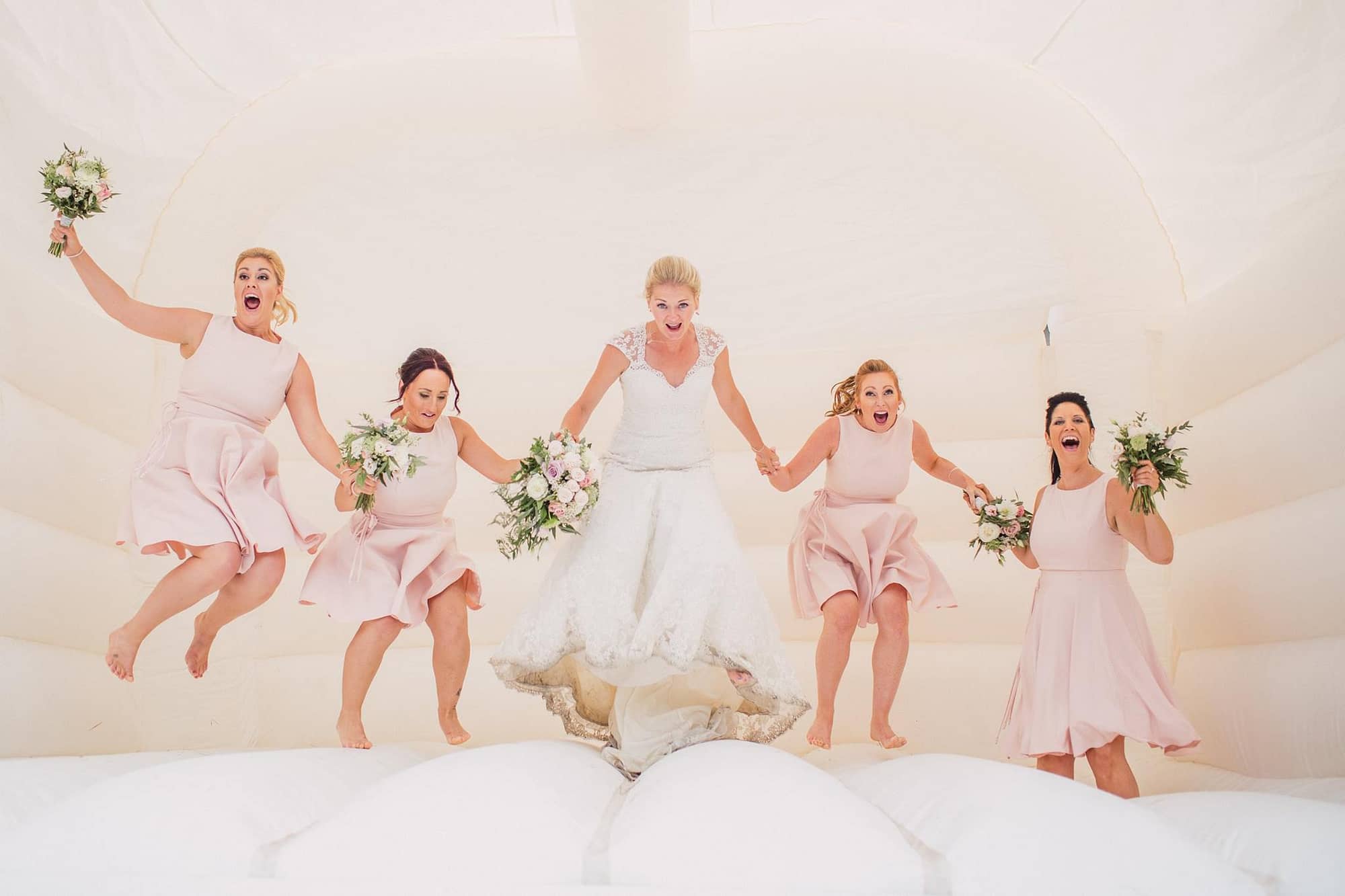 bride and bridesmaids bouncy castle