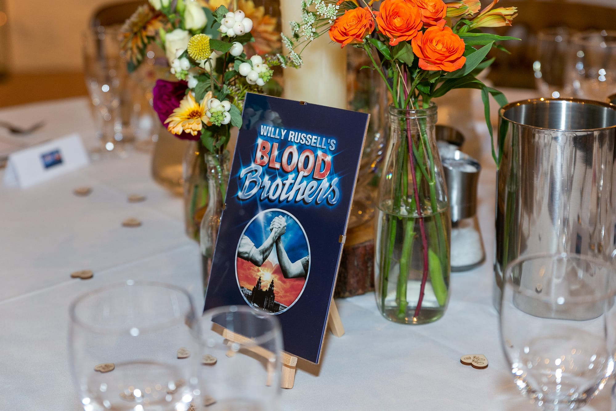 musical theatre themed table at pandean barn with flowers