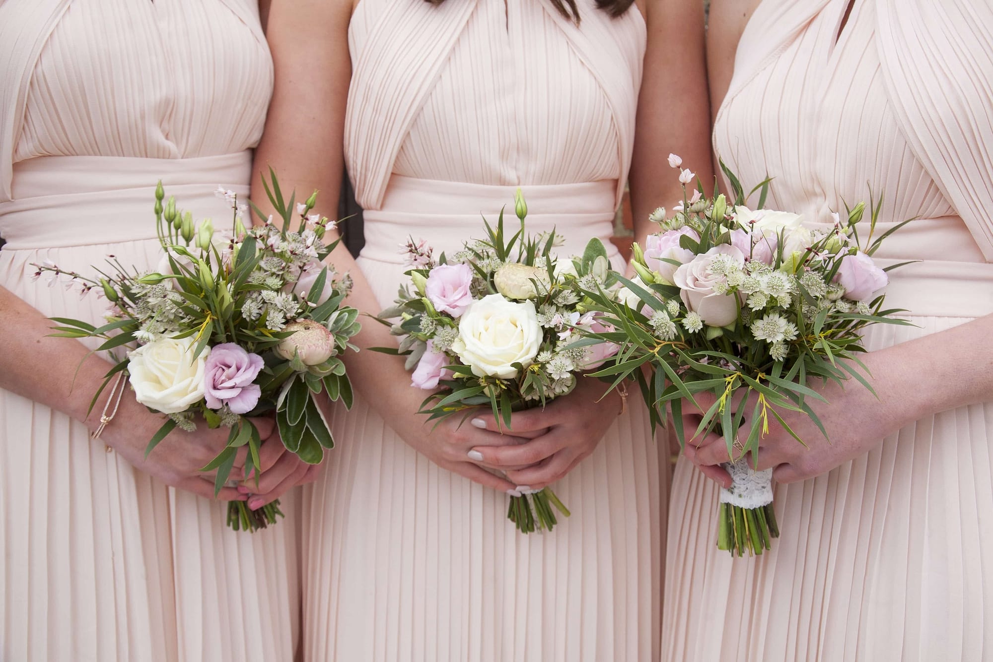 nude pink bridesmaid dresses with pink and white bridesmaids bouquets