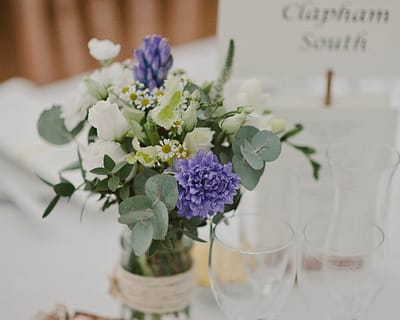 Table decoration with yellow and blue flowers - Horsham