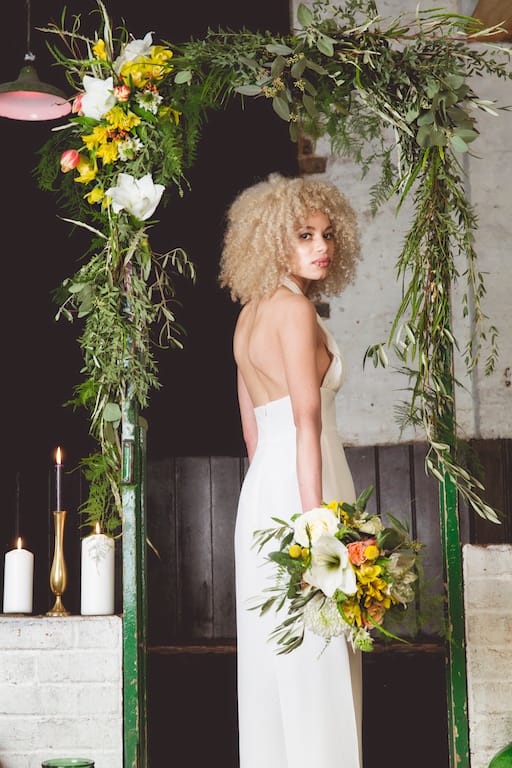 greenery wedding arch with yellow flowers, Sussex florist