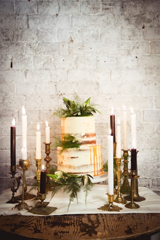 naked wedding cake with candle decoration