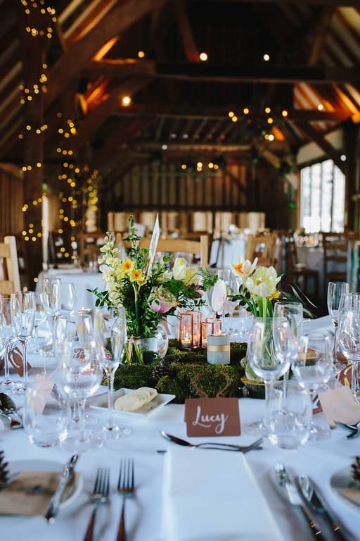 table centre flowers at southend barns wedding