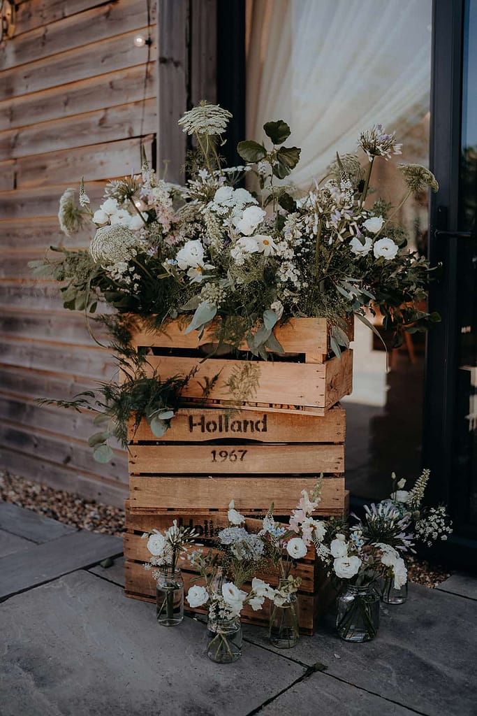 wooden crate floral display outside of the ceremony barn at chafford park estate