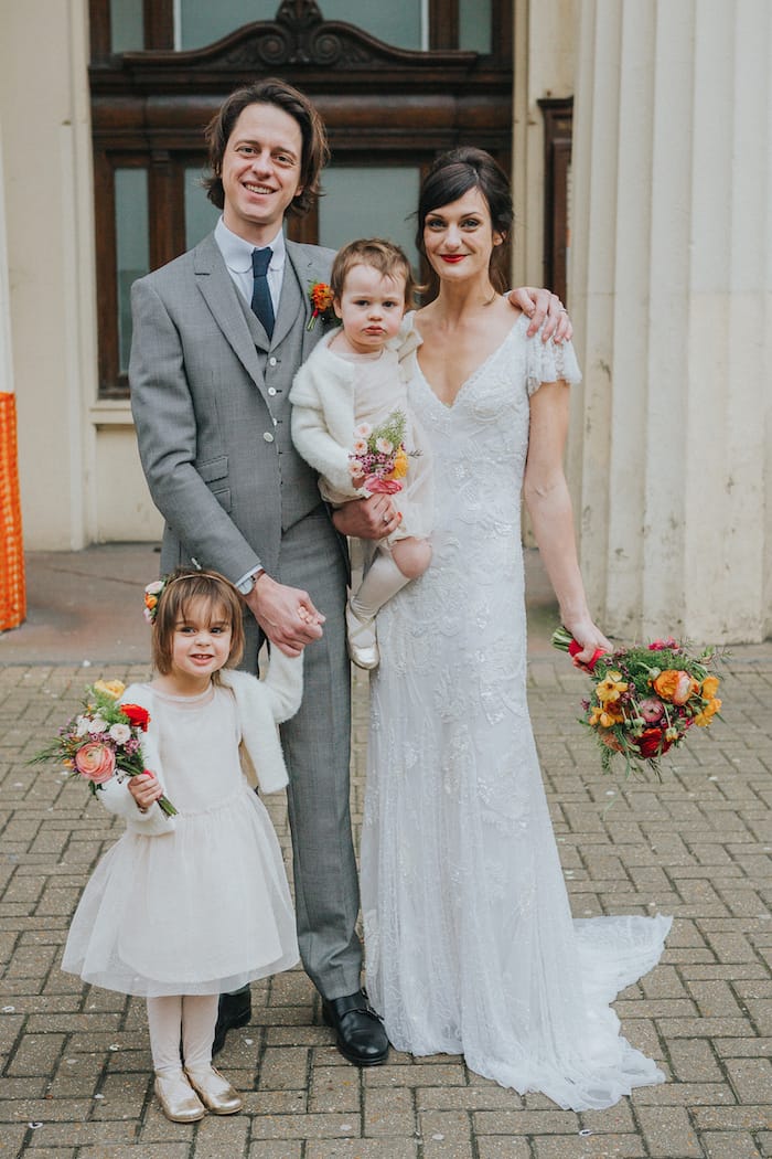 bride and groom and little daughters, family wedding shot Brighton