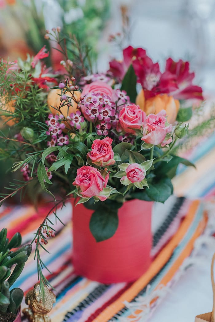 wedding table flowers in coloured tins