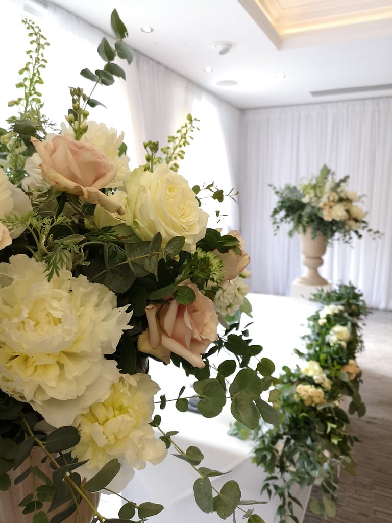 ceremony room wedding flowers at Alexander House Sussex