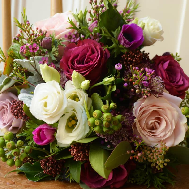 Winter bridal bouquet, roses, thistle, ivy, anemone