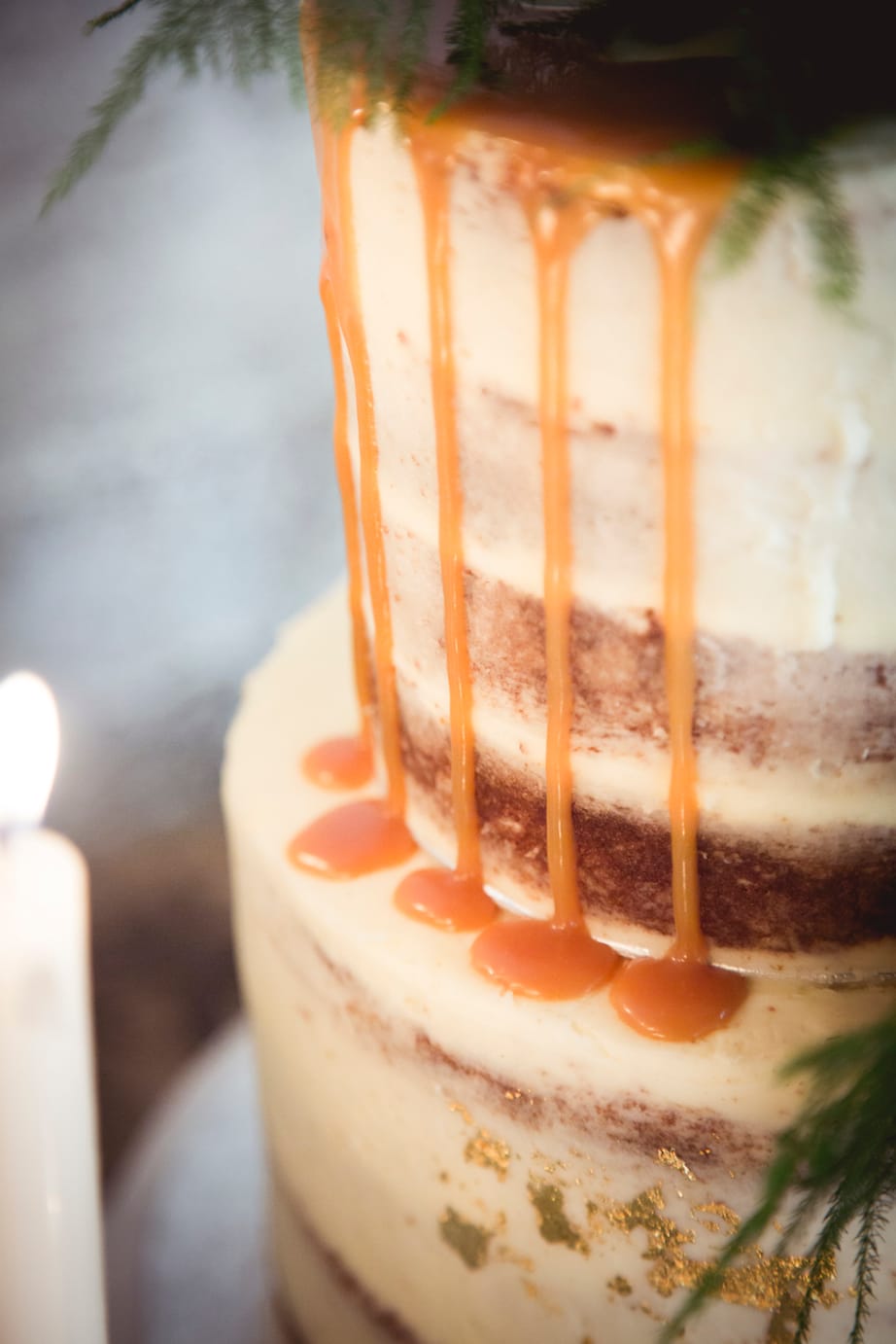 naked wedding cake with caramel drips