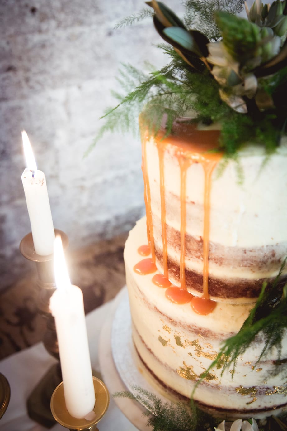 semi naked cake with fern and greenery decoration