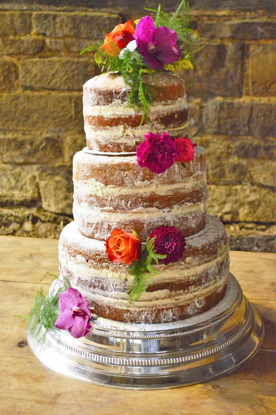 naked cake sussex orchids dahlias roses and fern
