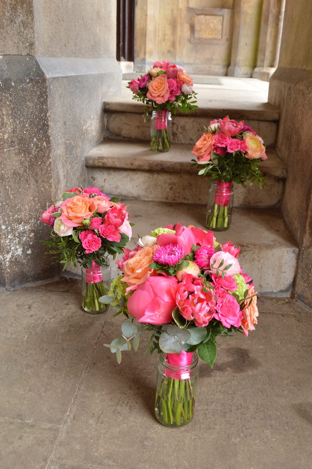 bride and bridesmaids bouquets, hot pink and peach