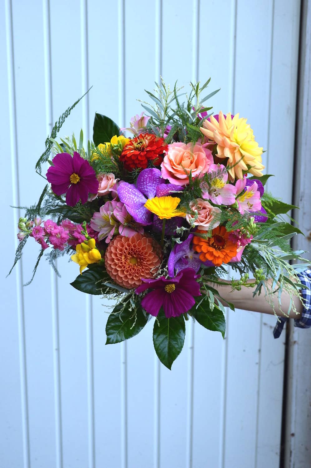 hot pink, peach and coral bridal bouquet, tropical leaf and orchid