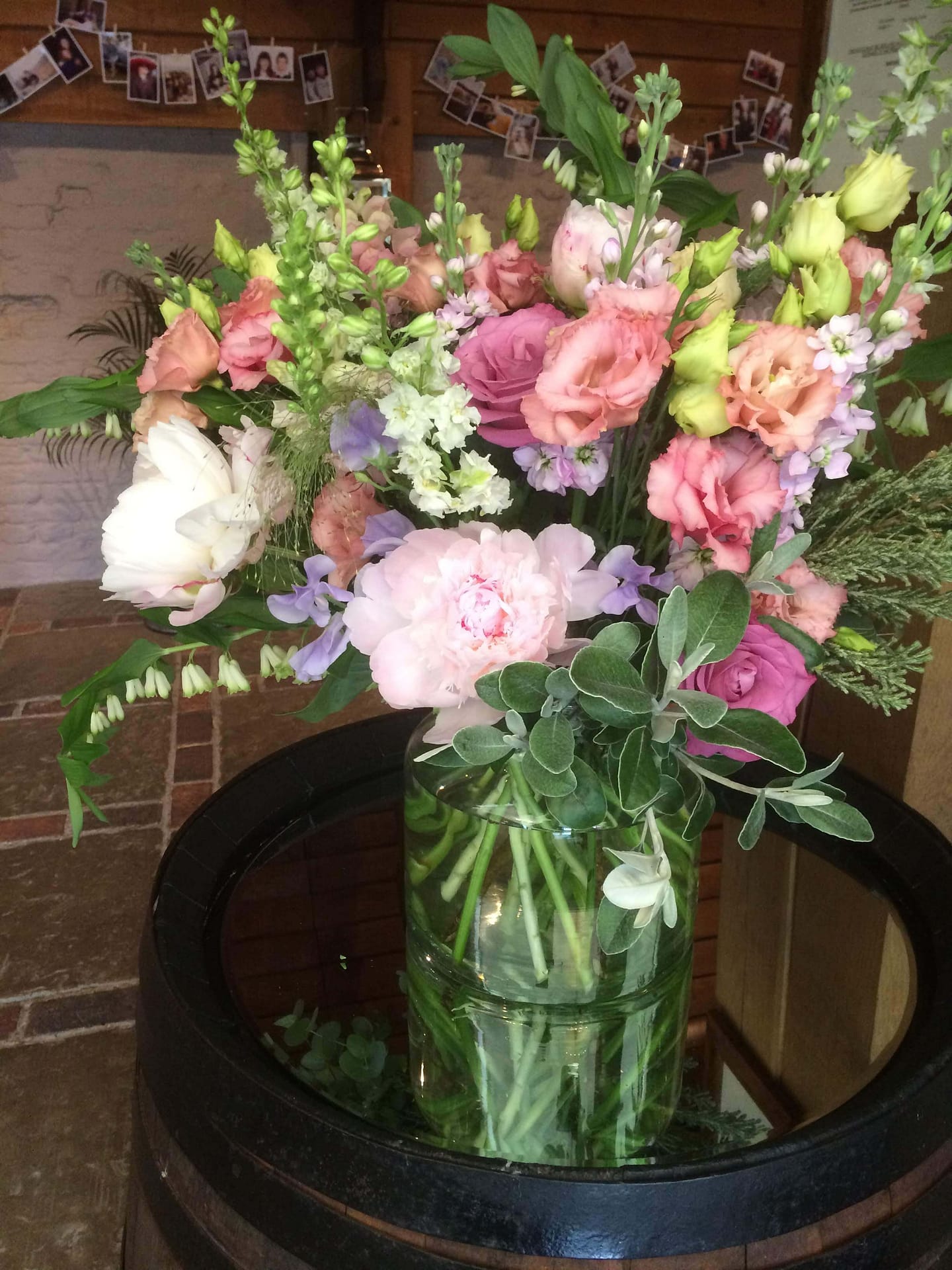 welcome vase arrangement on barrel at pangdean barn