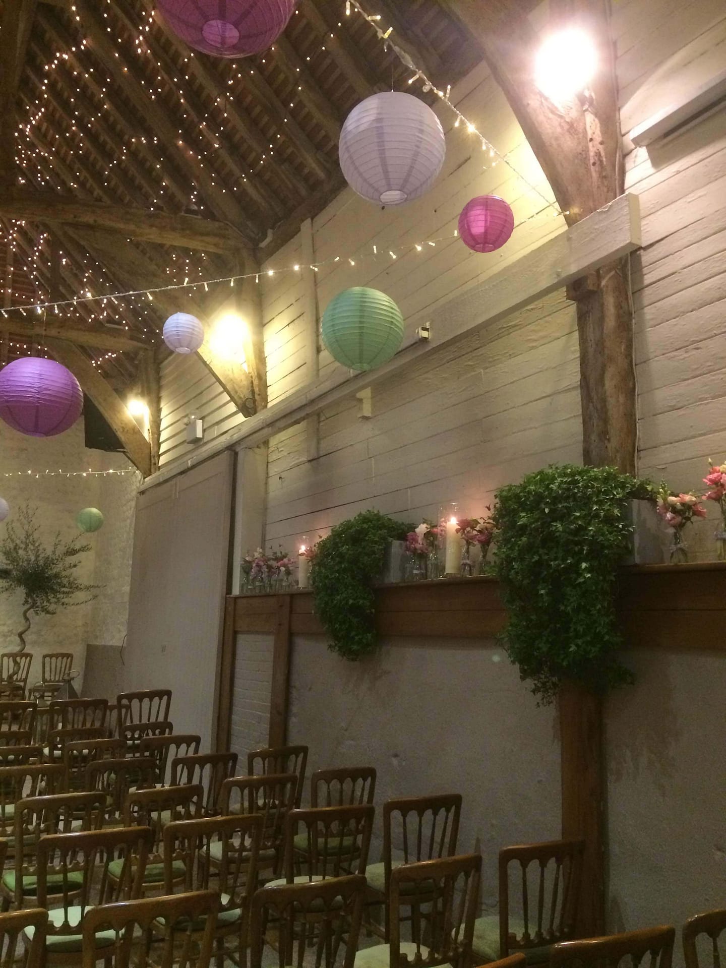 pangdean barn with hanging lanterns and flowers
