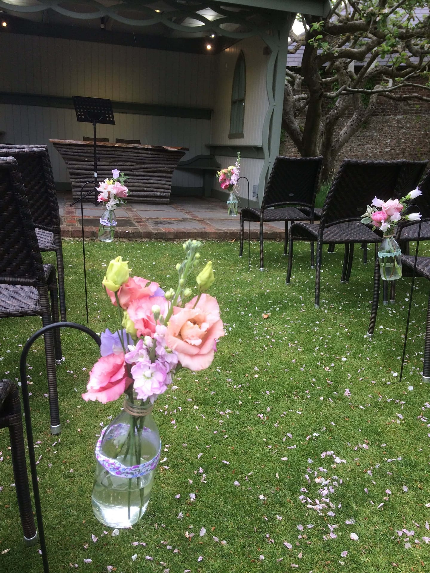 milk bottle pew ends for outdoor wedding at Pangdean Barn, East Sussex