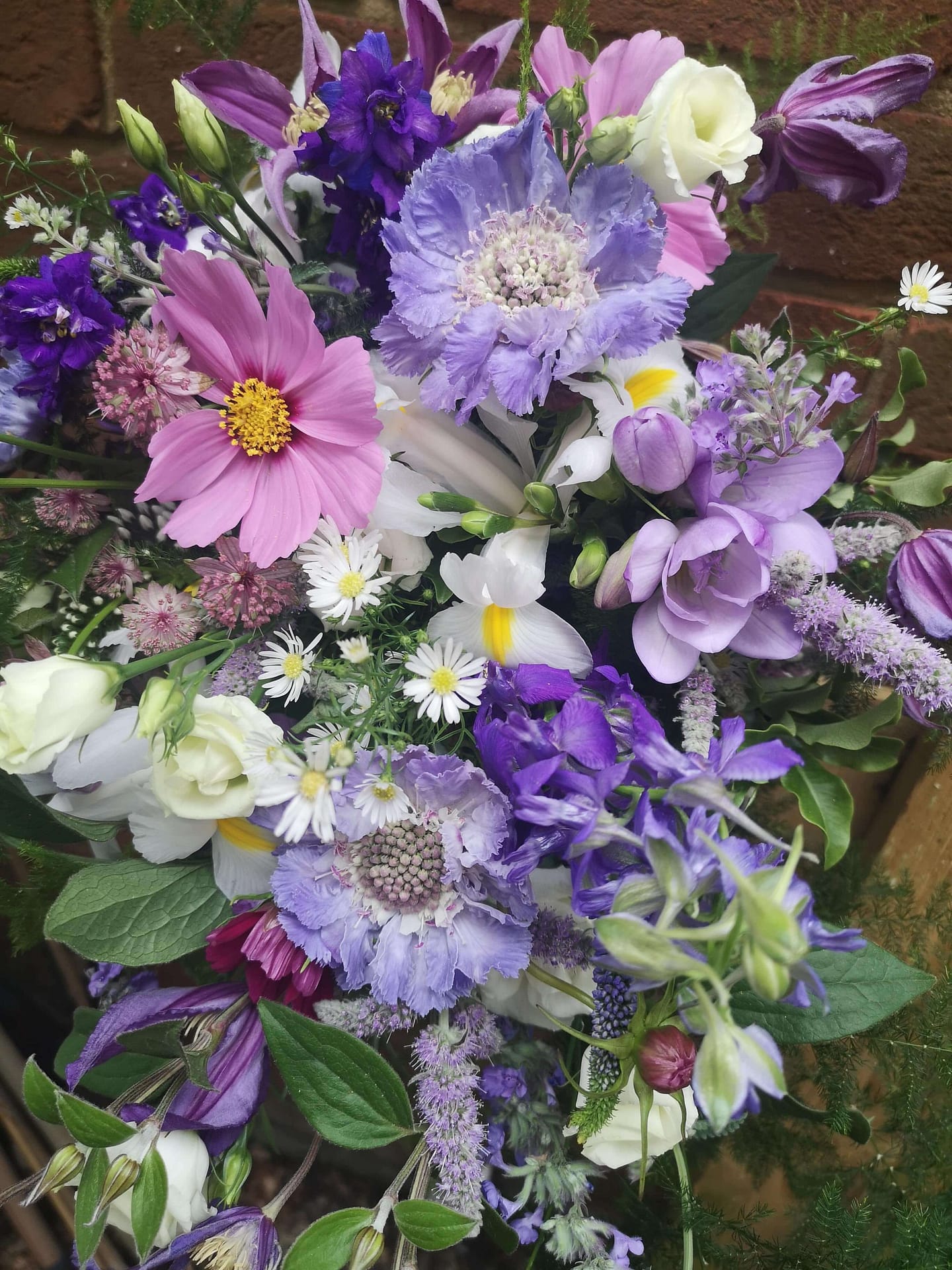 garden flower bridal bouquet in purples and lilacs